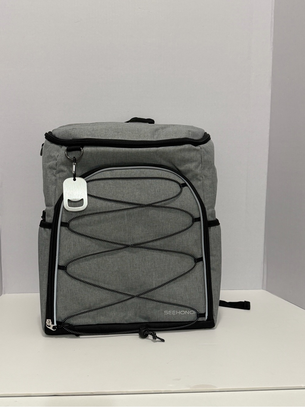 Gray Backpack with Front Bungee and Top Cooling Compartment